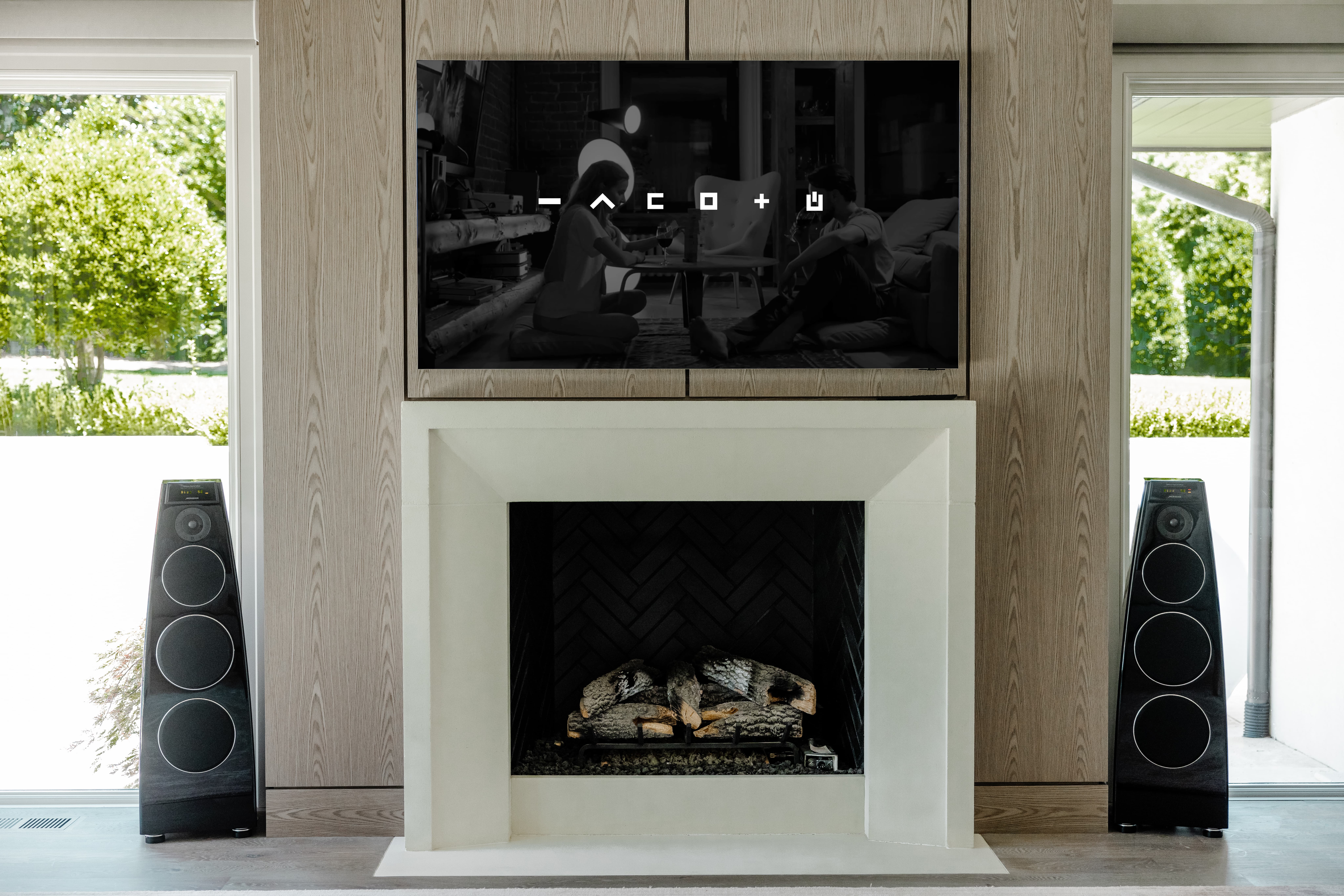 2 large wireless surround sound speakers in a home