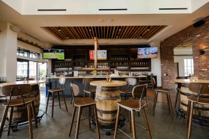 a room with a bar and a table